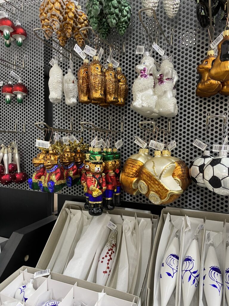 A selection of handcrafted Christmas decorations made from glass.