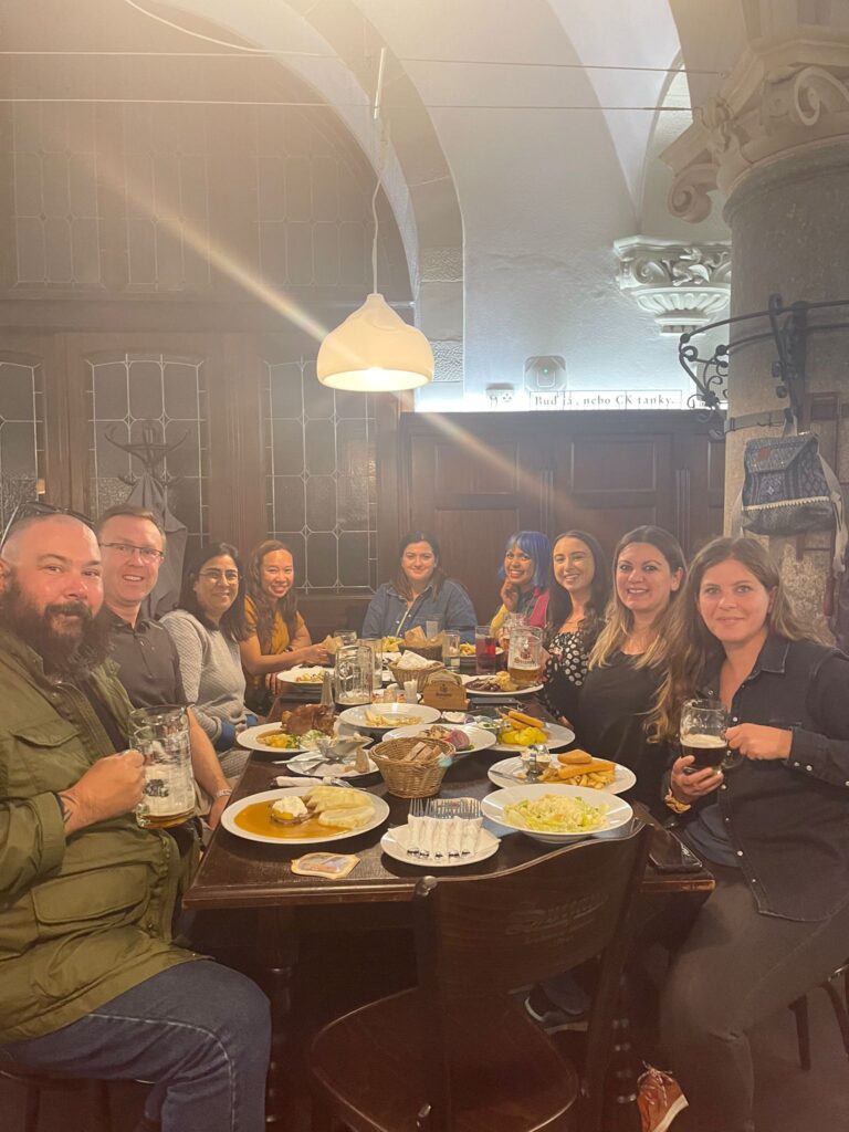 Friends sitting around table dinning at Radnicni Sklipek restaurant Liberec