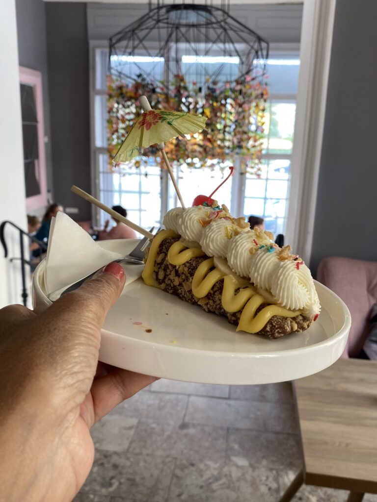Banaba cheesecake on a stick with cream on plate at Sorry pečeme jinak (Sorry, We Bake Differently) Cafe in Brno Czech Reubl