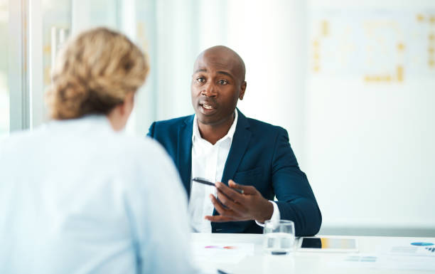 Defocused shot of a woman meeting with a professional businessman.