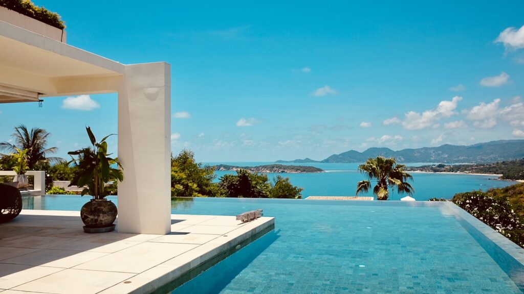 Property abroad, this is view of patio and pool over looking the sea and mountains