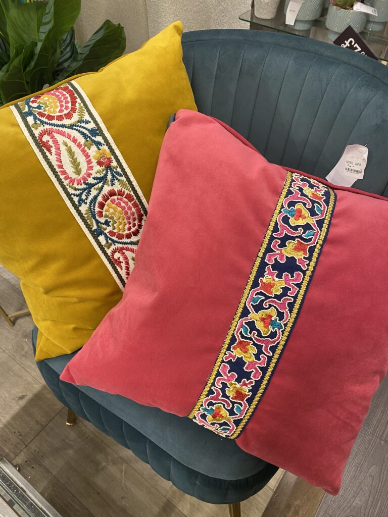 Mustard and bright pink cushions with Morrocan type braid