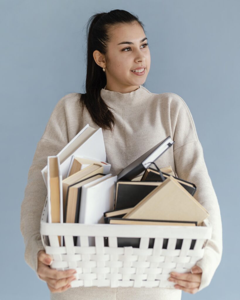 Lady holding basket of books
